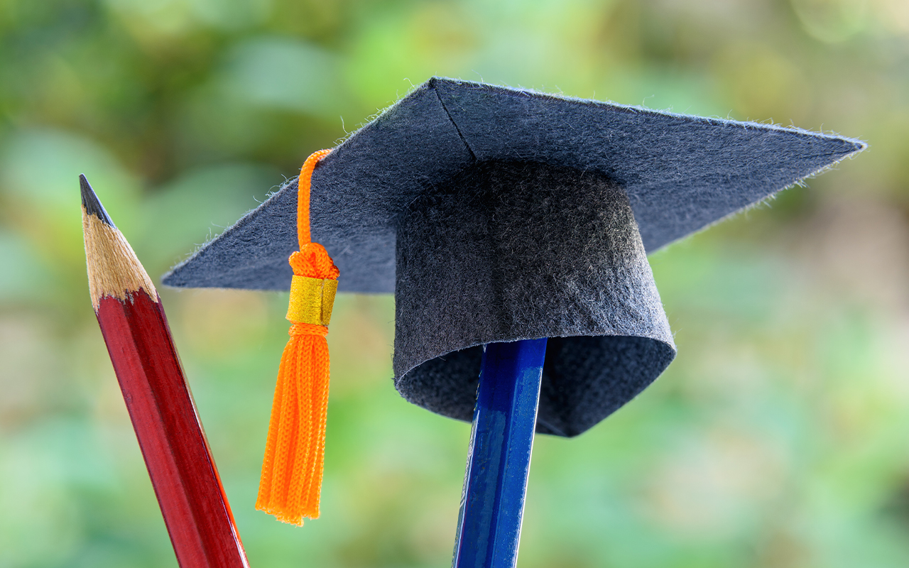 image of college diploma and pencil