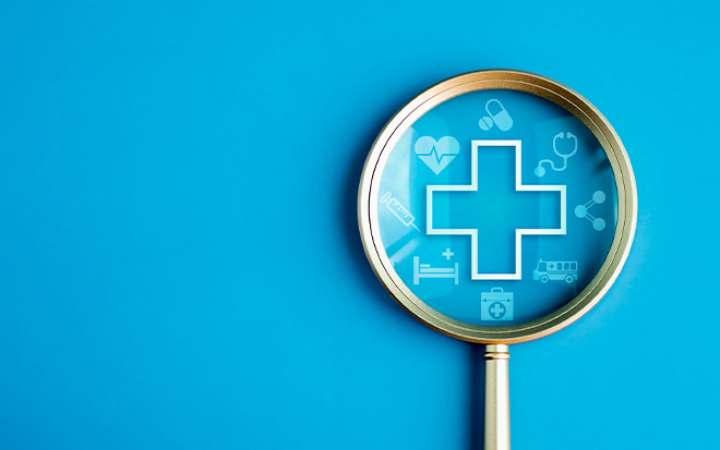 magnifying glass with medical symbols etched on the glass