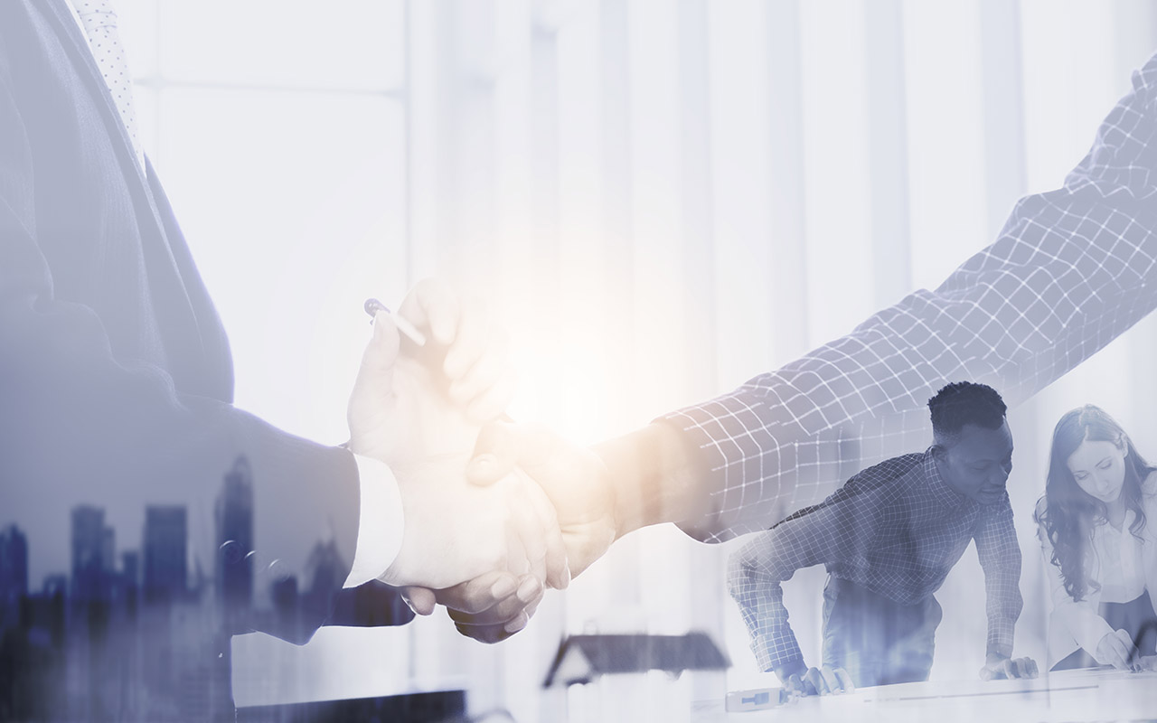 Business people group working together with handshake deal.