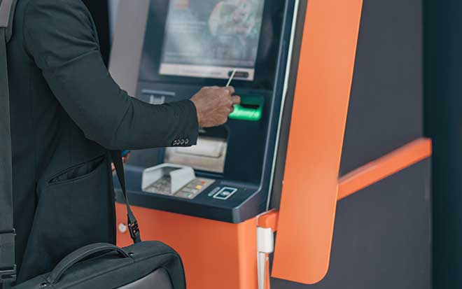 Stock photo of individual at ATM
