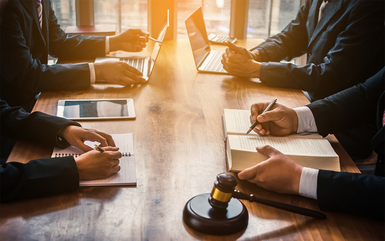 image of lawyers at conference table in negotiations