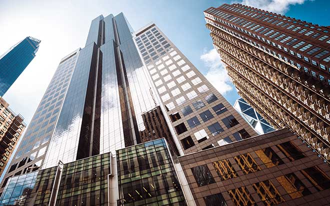 Looking up at high rise buildings