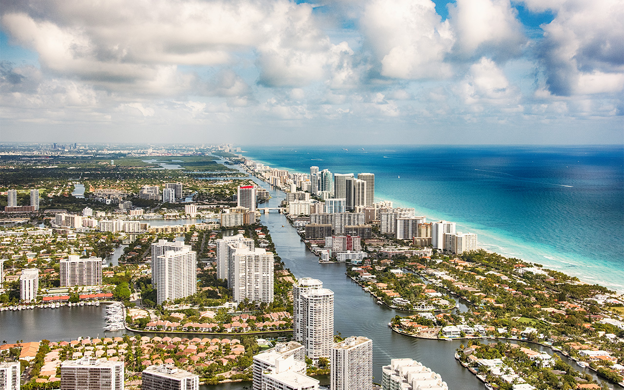 photo of Hotels and condominiums lining the beaches of beautiful South Florida just north of the city of Miami shot from an altitude of about 1000 feet.