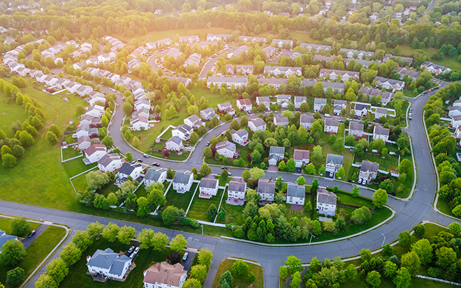 Aerial panorama view of a small town city home roofs at suburban residential quarters
