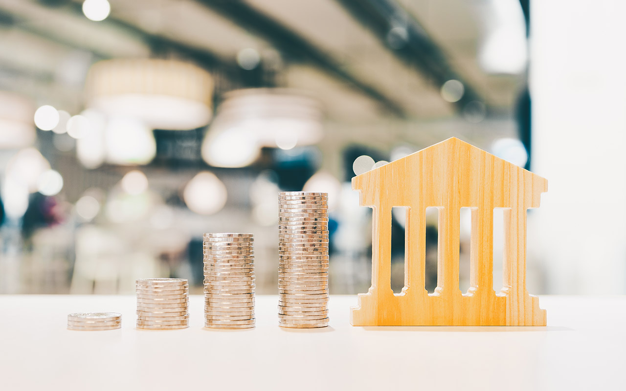 Bank symbol with with coins stack.