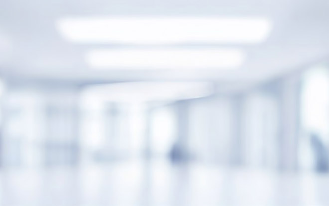 Beautiful light blue blurred background panoramic image of a spacious office or mall hallway.