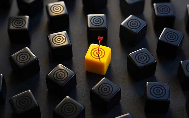 Image of multiple targets with an arrow hitting a single yellow target