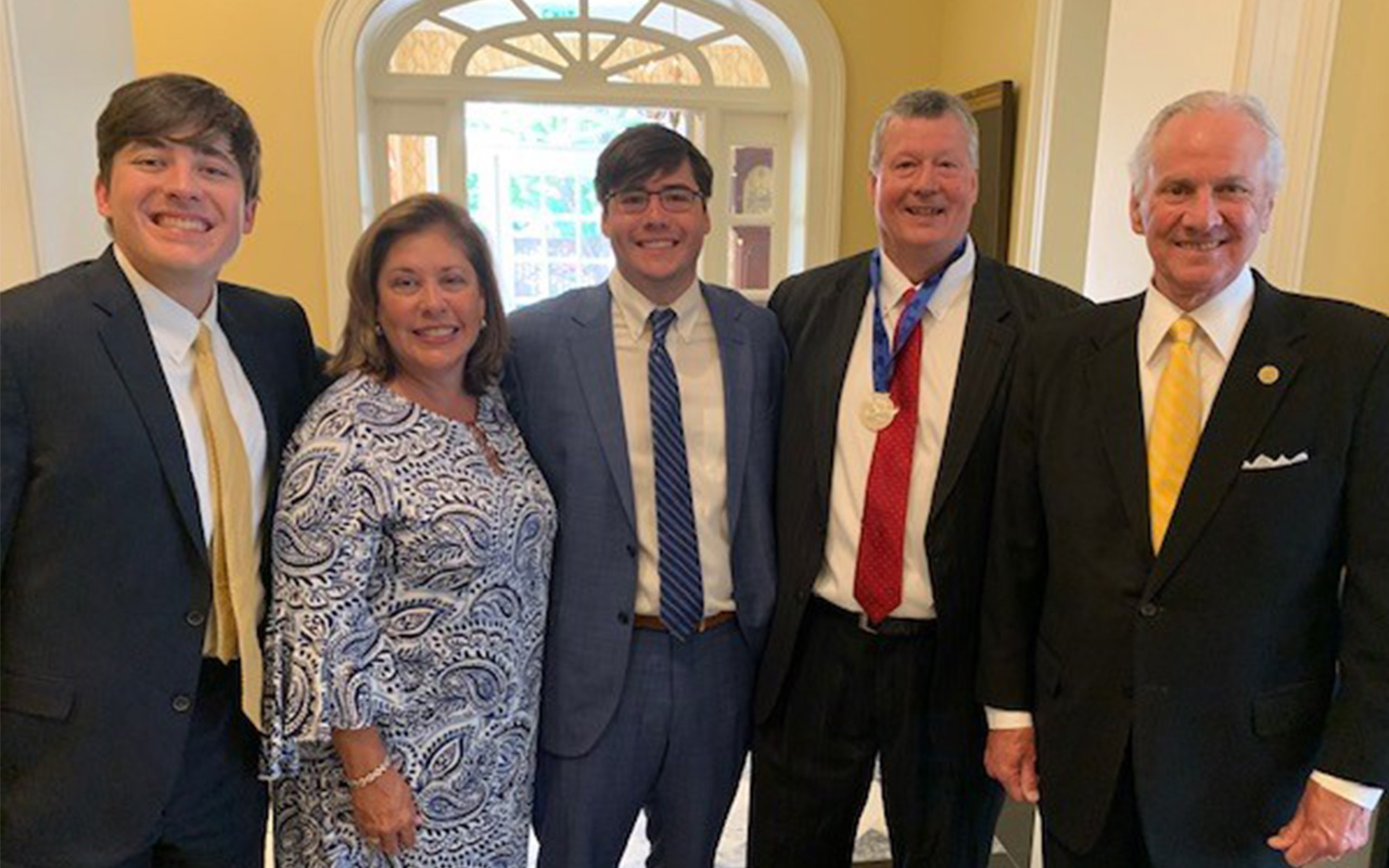 photo of Gus Dixon, S.C. Governor Henry McMaster, wife Kim, and sons Drew and Robert