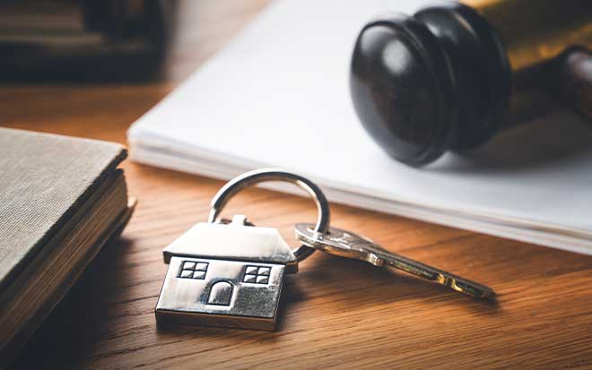 Set of keys on desk with house tag
