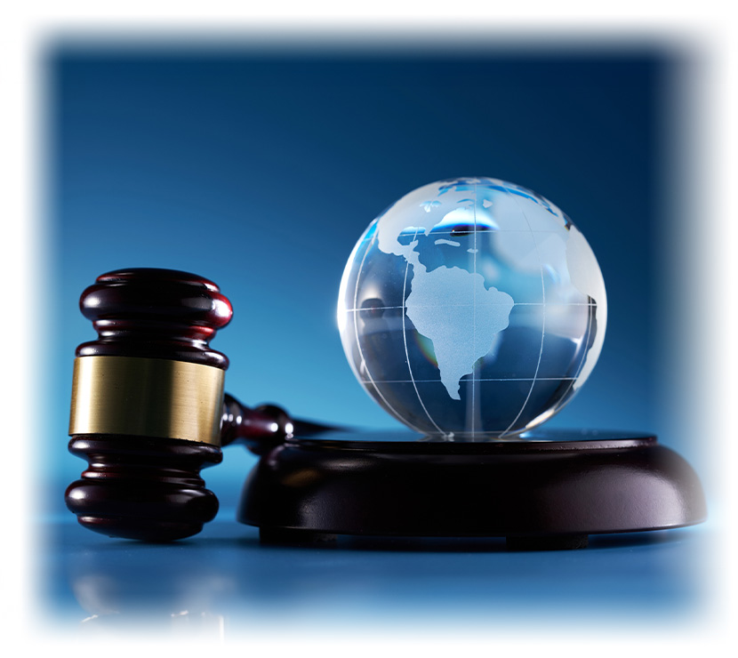 gavel hammer and glass globe against blue background