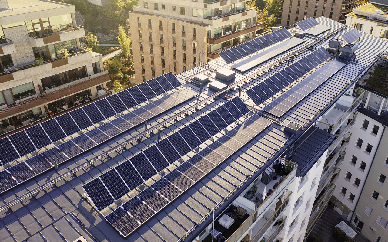 Solar panels on the roof of an apartment building in a residential district in Stockholm.