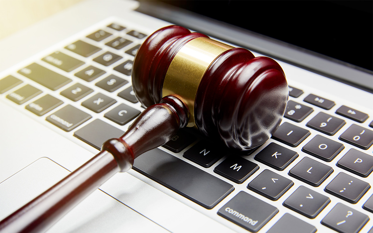 Gavel on computer keyboard