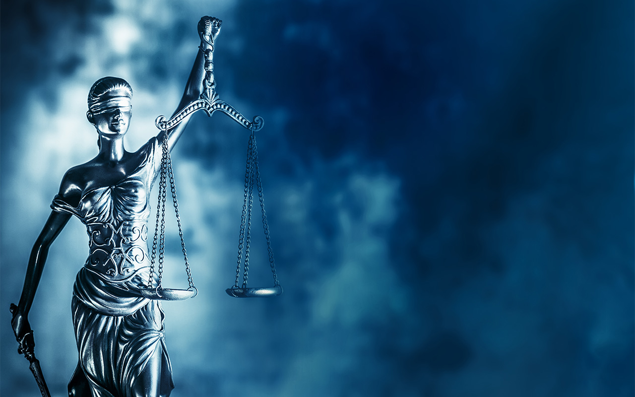 A statue of Lady Justice holding the scales of justice