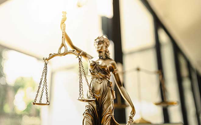 Image of a statue holding a scale