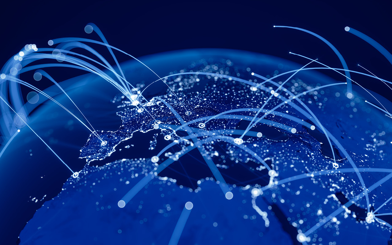 Globe with lights connecting different cities and countries.
