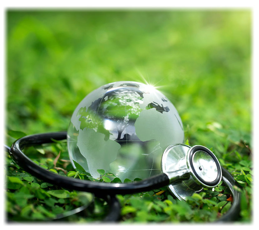 Environment Earth Day Concept. Crystal Earth with a medical doctor's stethoscope on green. Saving environment, and environmentally sustainable.