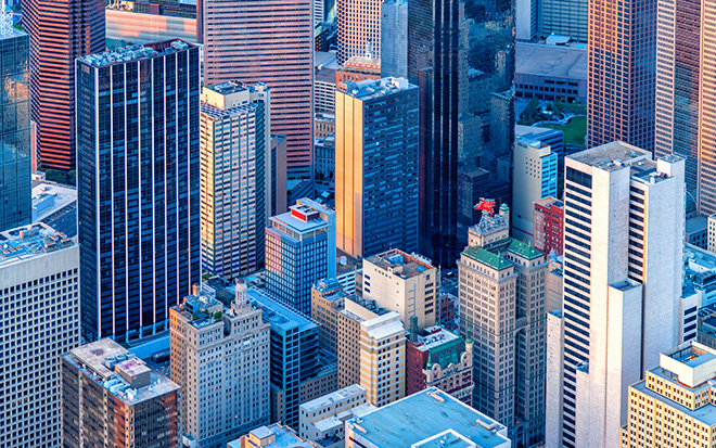 A full frame aerial view of beautiful downtown Dallas, Texas shot via helicopter from an altitude of about 15000 feet at dusk on an early spring evening.