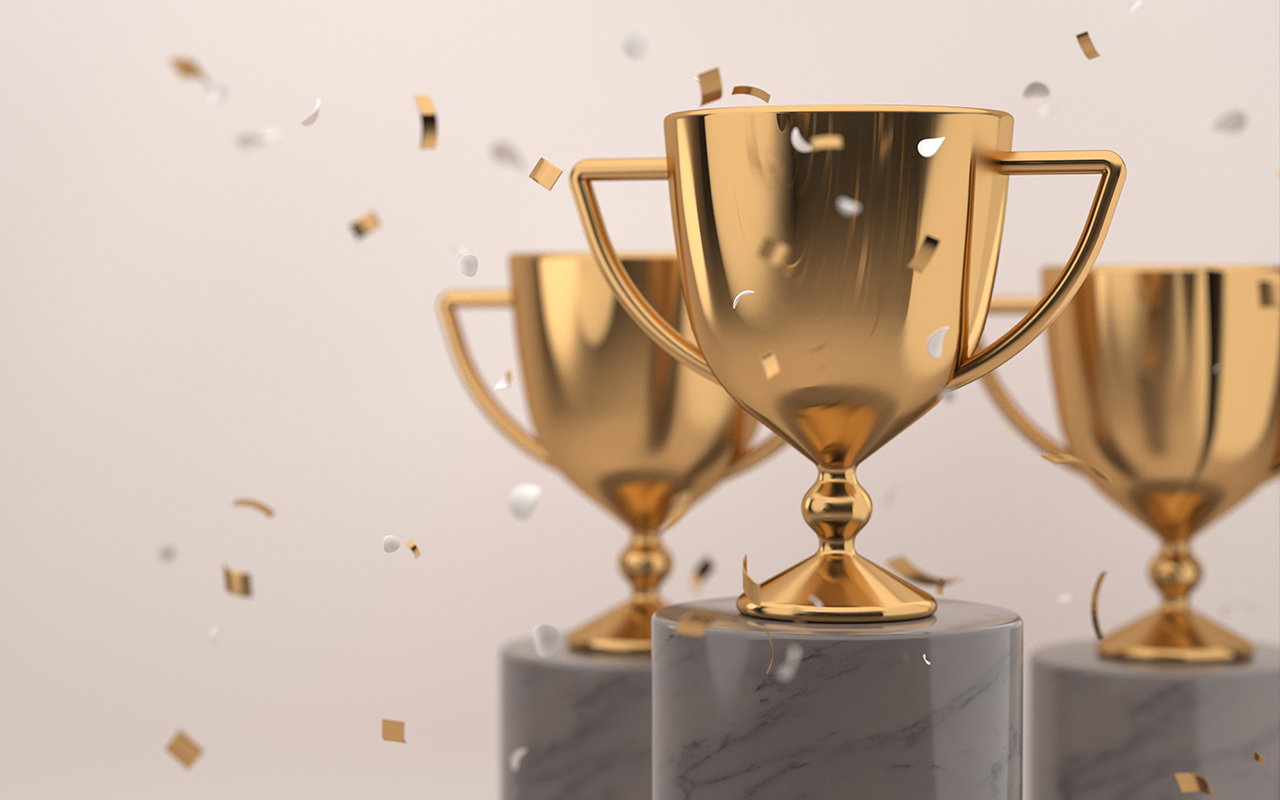 Gold trophies with confetti