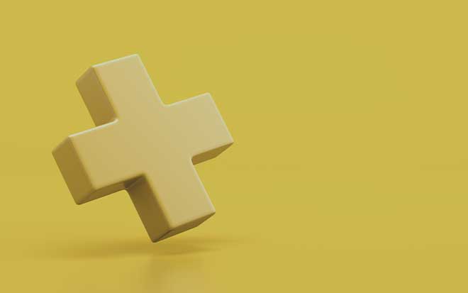 Yellow plus sign on yellow background