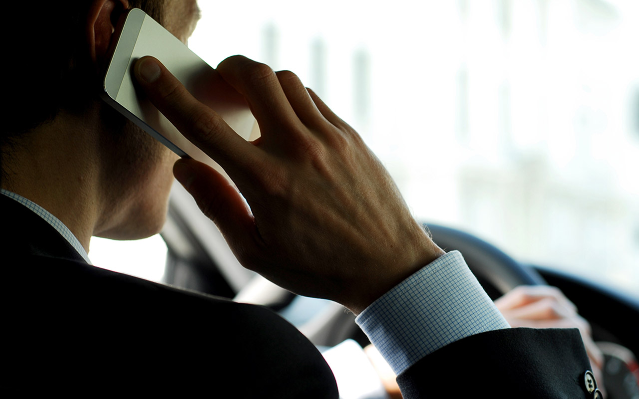 Man Driving While on the Phone