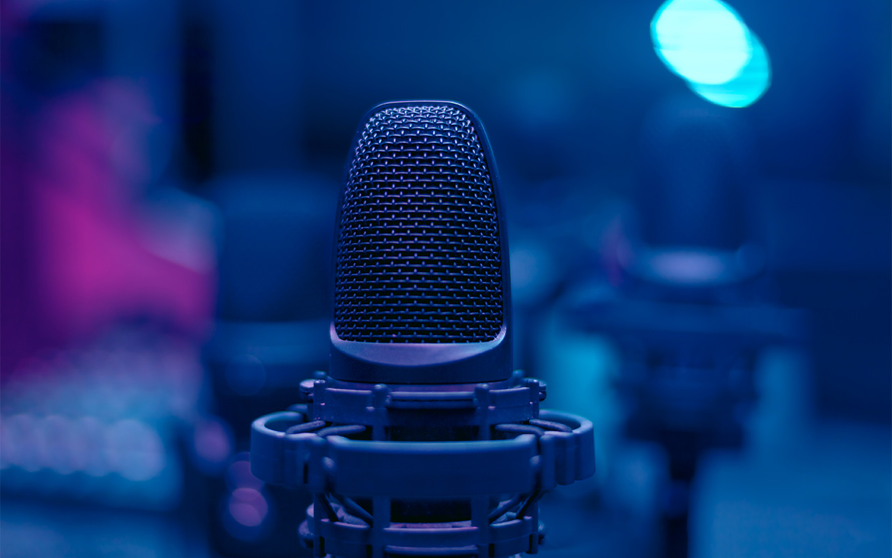 Microphone in blue room . Low light in broadcasting studio