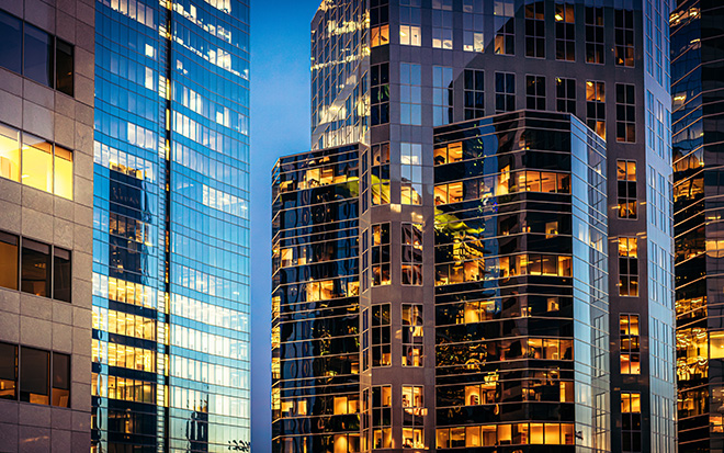 Modern glass offices at dusk
