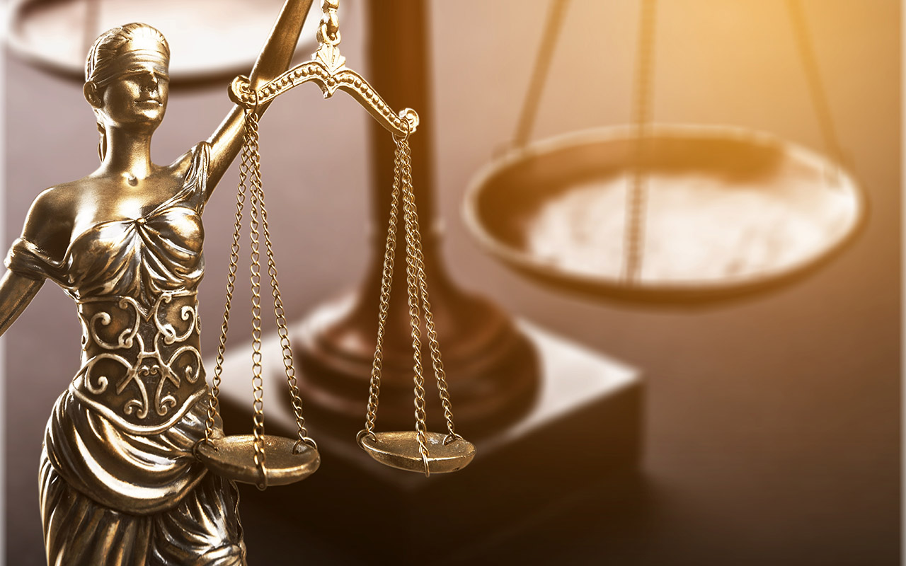 scales of justice on desk