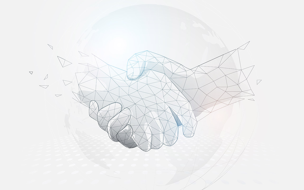 Image of shaking hands on a world map