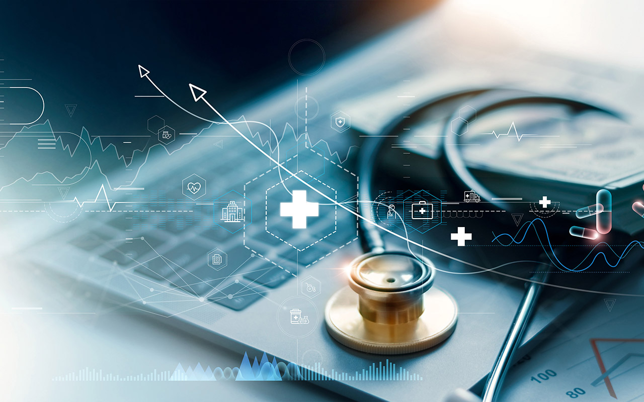 Image of healthcare symbols and gold stethoscope on laptop