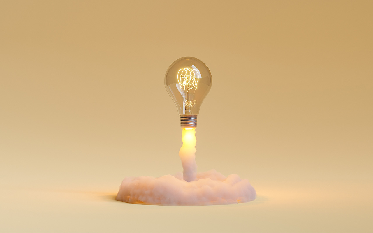Light bulb taking off and releasing smoke. concept of idea explosion, learning, education and startup.