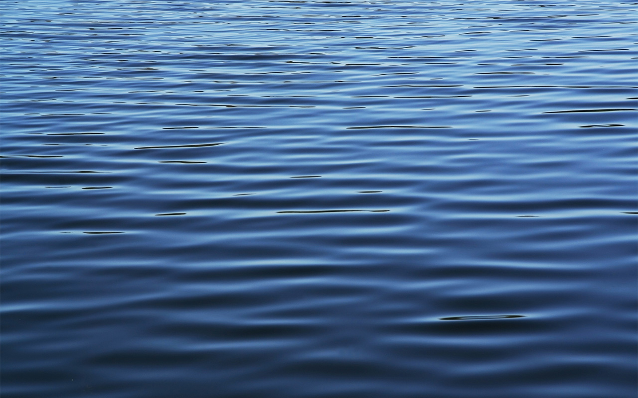 Soft blue waves - water surface on sea.