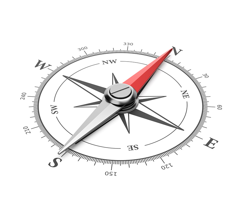 Compass on white background with red needle pointing North