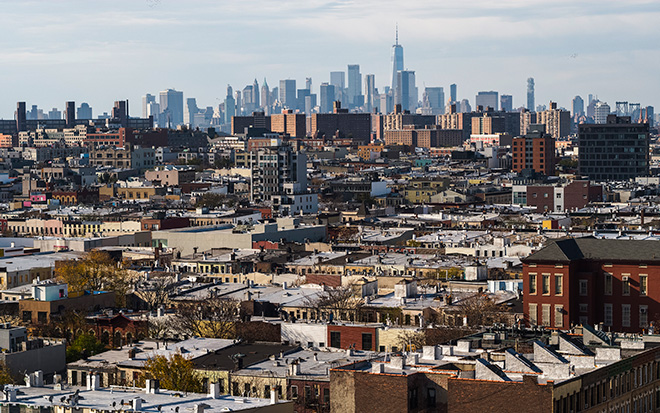 Residential district in Bushwick, Brooklyn, New York, with the distant view on Freedom Tower in Lower Manhattan.