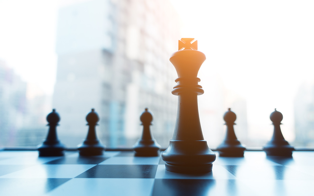 Chess board with buildings in background