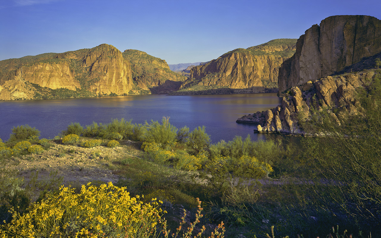 A canyon surrounds a river.